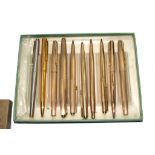 A rolled gold Parker four piece pen and pencil set, another rolled gold pencil, four rolled gold