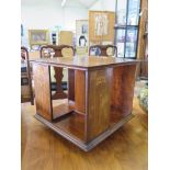 A late Victorian Art Nouveau design inlaid mahogany table top revolving bookcase, 37 cm square, 32.5