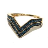 A 9 carat gold ring, set with blue diamonds