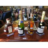 A bottle of Veuve Monsigny Brut No.3 Champagne; a bottle of Prosecco; a bottle of Hine Rare VSOP