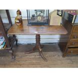 A 19th century mahogany tripod table, the rectangular top on a turned stem, 86 x 60 cm, 70cm high