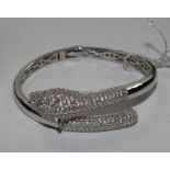 A 925 silver bangle with leopards head design and set with Swarovski stones, in J. McCarthy box