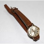 A ladies gold wristwatch by Thos. Russell & Sons