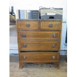 A small George III style mahogany chest of drawers, with chevron banding, the two short and three