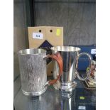 A Royal Selanger pewter tankard with fine detail and a wooded handle and original box, together with
