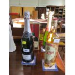 A bottle of Fortnum & Mason Blanc de Blancs Grand Cru Champagne; a bottle of Duval LeRoy Premier Cru