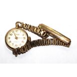 A ladies 9 carat gold wrist watch on a gold bracelet