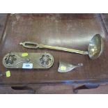 A brass pen tray, a brass ladle, and a brass shoe horn