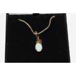 An opal pendant, set with 9 carat gold neck chain
