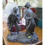 A Japanese bronze figure group, depicting a samurai and his travelling companion both laughing,