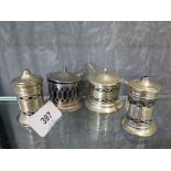 A four piece silver condiment set