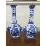 A pair of Chinese blue and white hexagonal vases, depicting panels of vases and fans, unmarked, 31cm