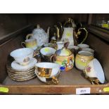 A Bavarian gilt porcelain coffee set, a Japanese porcelain coffee set and a teapot