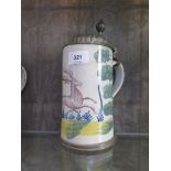 An early 19th century German faience stoneware stein, depicting a stag, the pewter lid engraved with