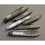 A collection of six mother of pearl fruit knives with hallmarked silver blades