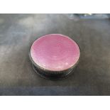 A silver and pink enamel patch box