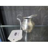 A miniature silver handled jug, Birmingham 1924
