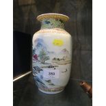 A famille rose vase, enameled with a river landscape, stamped six character mark on base, 20 cm high