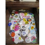 A collection of pin badges from the 1970s onwards