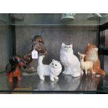 Two Beswick figures of seated cats, model no. 1857, one in white the other in brown, another