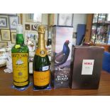 A bottle of Veuve Clicquot Brut Champagne; a bottle of Hine Rare VSOP Champagne Cognac; a bottle