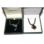 A 925 silver and marquisette pendant with a turquoise drop, and an elephant necklace, both in boxes