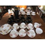 A Portmeirion black Greek key pattern coffee service, and a Duchess tea service with rose decoration