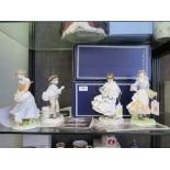 A pair of Royal Worcester 'Old Country Ways' figures, a pair of Coalport figures, a Royal