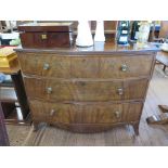An early 19th century mahogany bow front chest of drawers, with three long graduated drawers on