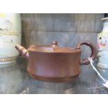 A Yixing teapot, of circular form with bamboo shape handle and spout, impressed four character mark,