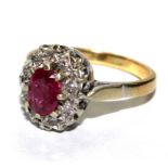 A ruby and diamond cluster ring, on 18 carat gold