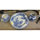 An 18th century Chinese blue and white plate, depicting buildings in landscapes, unmarked, 23cm