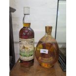 A bottle of George & J.G. Smith's 15 year old Glenlivet Whisky; and a bottle of Dimple Scotch Whisky