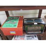 A Melodeon, in original box with beginner's guide