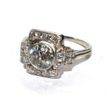 A 18 carat white gold stamped fancy design diamond cluster ring, with old cut centre diamond in a