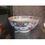 A famille rose punch bowl, with chrysanthemum and scroll design, 22.5 cm diameter