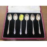 A boxed set of six silver coffee spoons