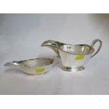 A silver sauce boat, with single foot 1964 Sheffield, and a silver cream boat Birmingham 1905