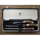 A Mapin & Webb cased three piece carving set with antler horn handles