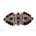 A diamond and ruby double clip circa 1940, breaking down to two clips and a brooch