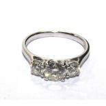 A ladies three stone diamond ring, set in 18 carat white gold