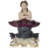 A Porcelain Figurine of a Naiad with a Seashell