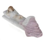 An Amusing Erotic Porcelain Figurine of a Reclining Lady