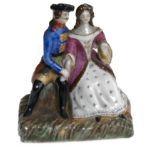 A Miniature Porcelain Figurine of a Couple