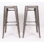 A PAIR OF GREY METAL BAR STOOLS with splayed legs, each 77cm high