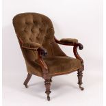 A VICTORIAN ROSEWOOD FRAMED, BUTTON UPHOLSTERED LIBRARY ARMCHAIR with turned front legs and brass