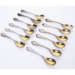 A SET OF TWELVE GILDED EGG SPOONS with RMB engraved finials with indistinct marks 'sterling'? with