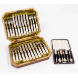 A CASED SET OF SIX BIRMINGHAM SILVER TEASPOONS with shaped finials and a mahogany cased set of