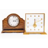 A SWISS MADE GILT METAL AND PERSPEX MANTLE CLOCK with a presentation inscription, 18cm wide x 16cm