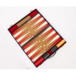 A FAUX REPTILE SKIN CASED BACKGAMMON SET with two original dice cups